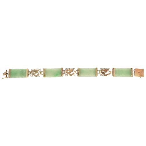 3034 - A Chinese 14ct gold and green jade panel bracelet, 17cm in length, 15.5g.