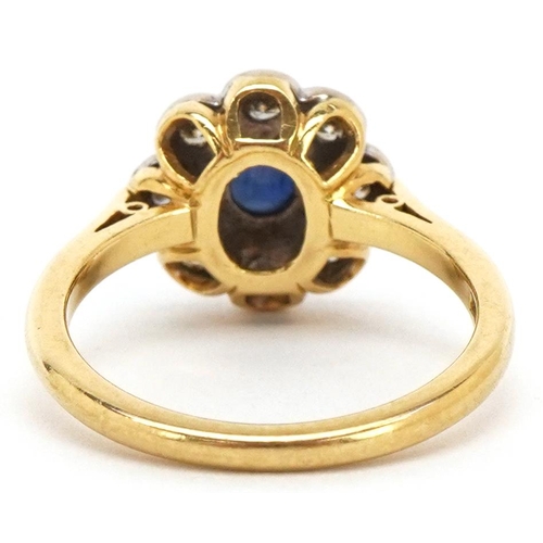 3011 - An 18ct gold cabochon sapphire and diamond flower head ring, each diamond approximately 2.20mm in di... 