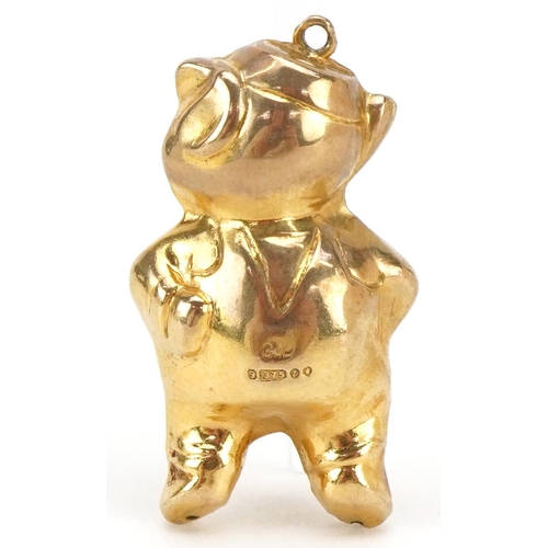 3130 - A 9ct gold and enamel charm in the form of a comical pig, 3cm high, 2.8g.