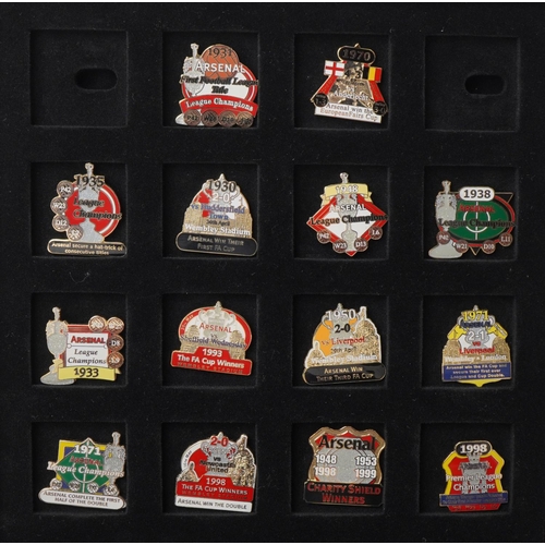 1415 - A collection of thirty Arsenal enamel Victory pin badges within a red wooden case, W-25cm.