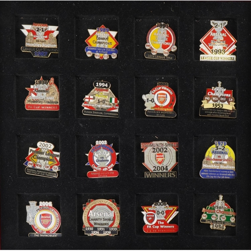 1415 - A collection of thirty Arsenal enamel Victory pin badges within a red wooden case, W-25cm.