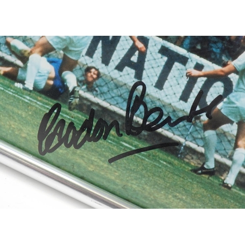 1414 - A Gordon Banks signed colour photograph: The Pelé Save, signed in black ink, within a silvered frame... 