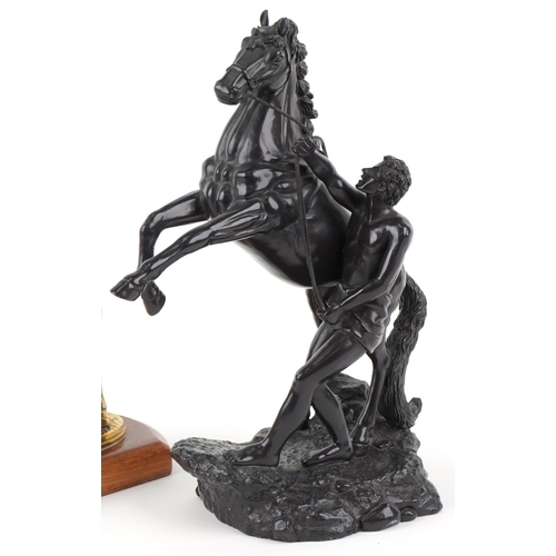 1558 - A late 20th century resin Marley horse figure group, 31cm high, together with a bronze figure of a h... 