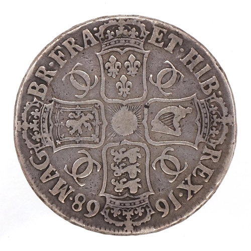 1242 - A Charles II 1668 silver crown with script to the edge.