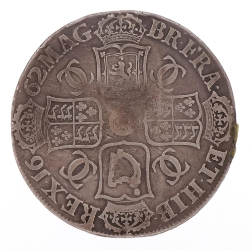 1243 - A Charles II 1662 silver crown with script to the edge.