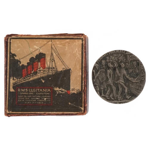 1320 - An R.M.S. Lusitania commemorative medal housed in a red box with image of RMS Lusitania.