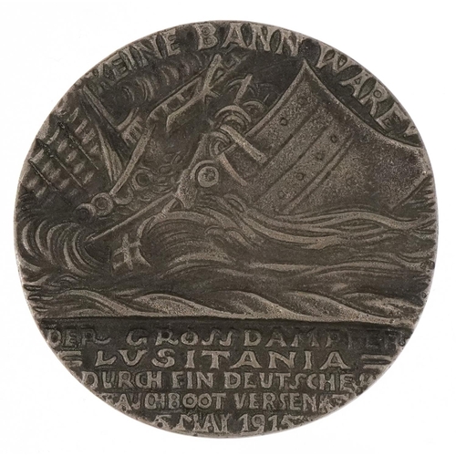 1320 - An R.M.S. Lusitania commemorative medal housed in a red box with image of RMS Lusitania.