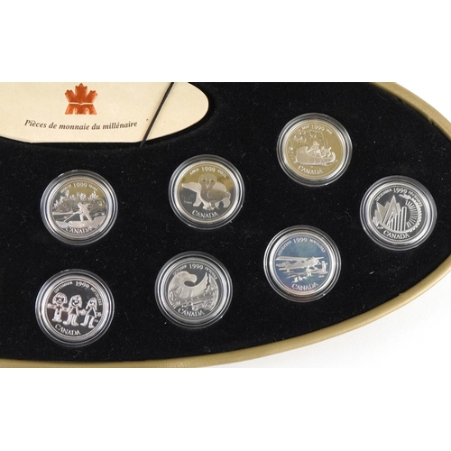 1315 - A 1999 Canada Millennium twelve coin set of silver twenty five cents, housed in an oval gold coloure... 