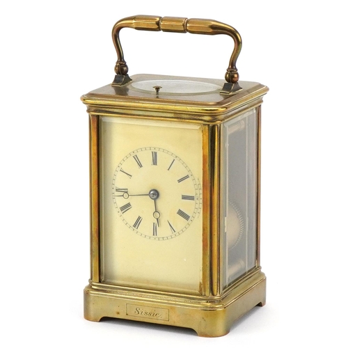 203 - A 20th century gilt brass repeater carriage clock with swing handle, the white enamel dial with blac... 