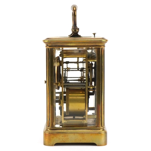 203 - A 20th century gilt brass repeater carriage clock with swing handle, the white enamel dial with blac... 