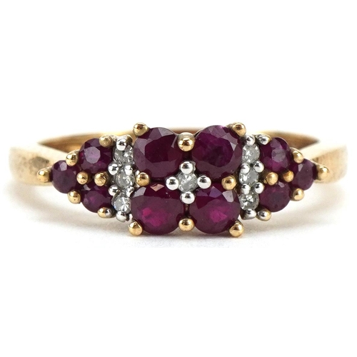 3086 - A 9ct gold ruby and diamond cluster dress ring, size O, 2.6g.