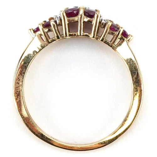 3086 - A 9ct gold ruby and diamond cluster dress ring, size O, 2.6g.