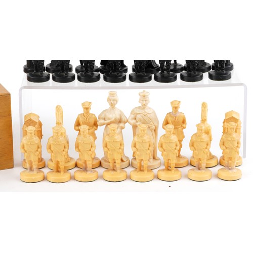 1147 - A 20th century resin chess set, the king 10cm high, within a wooden box, 35cm wide.