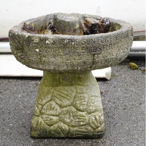 2177 - A 20th century concrete birdbath raised on a naturalistic base, 31cm high.