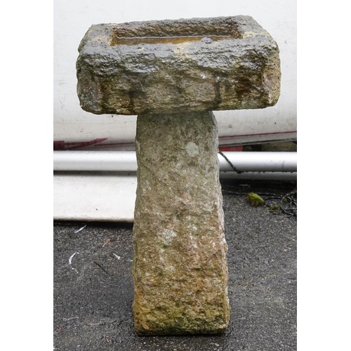 2178 - A 20th century cast composition square birdbath raised on a block base, 47cm high.