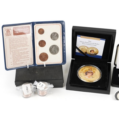 1319 - Two silver proof Queen Elizabeth five pound coins, A Canadian 1965 silver dollar, a Diana Princess o... 