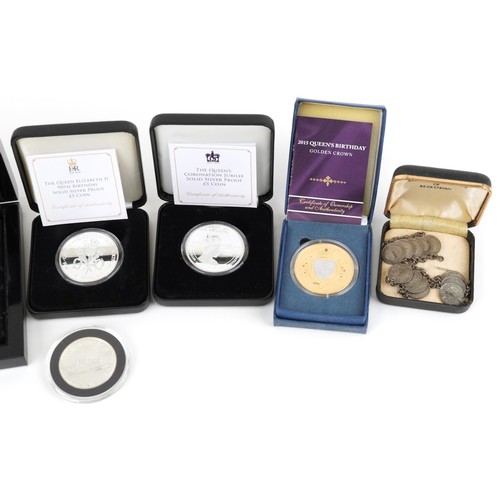 1319 - Two silver proof Queen Elizabeth five pound coins, A Canadian 1965 silver dollar, a Diana Princess o... 