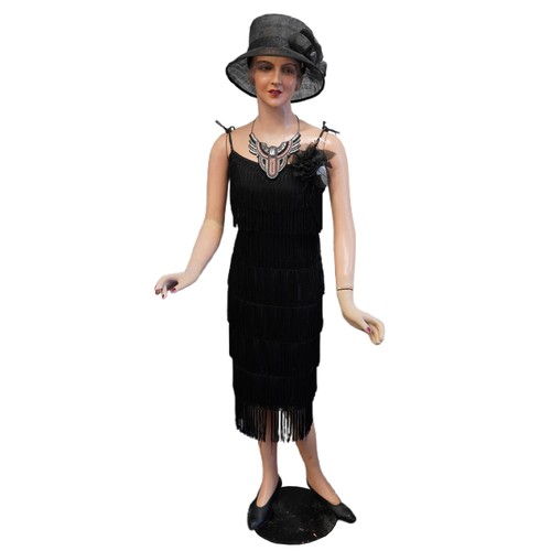 350A - A 1930s papier mâché mannequin of an Art Deco female wearing a Debut dress and an Art Deco style nec... 