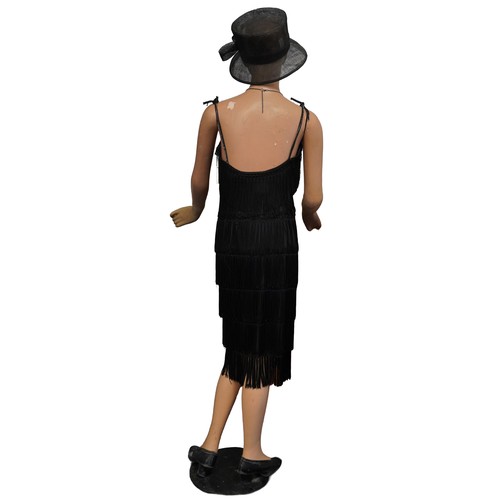 350A - A 1930s papier mâché mannequin of an Art Deco female wearing a Debut dress and an Art Deco style nec... 