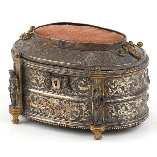 309 - A 19th century French oval gilt metal jewellery casket, the hinged lid revealing a green velvet line... 