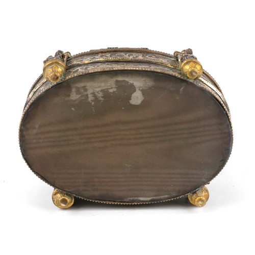 309 - A 19th century French oval gilt metal jewellery casket, the hinged lid revealing a green velvet line... 