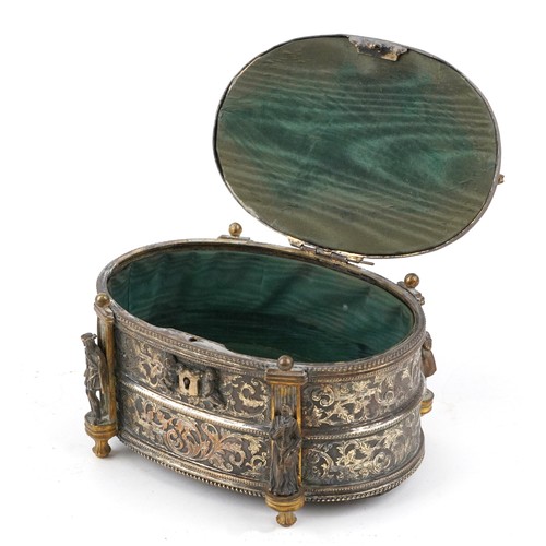 309 - A 19th century French oval gilt metal jewellery casket, the hinged lid revealing a green velvet line... 