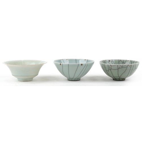 469 - Two similar Chinese green celadon crackle glazed circular bowls, 20th century, signed to bases, 14cm... 