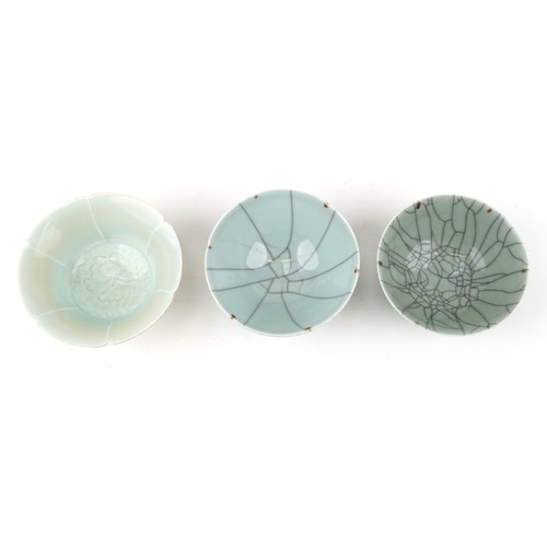 469 - Two similar Chinese green celadon crackle glazed circular bowls, 20th century, signed to bases, 14cm... 