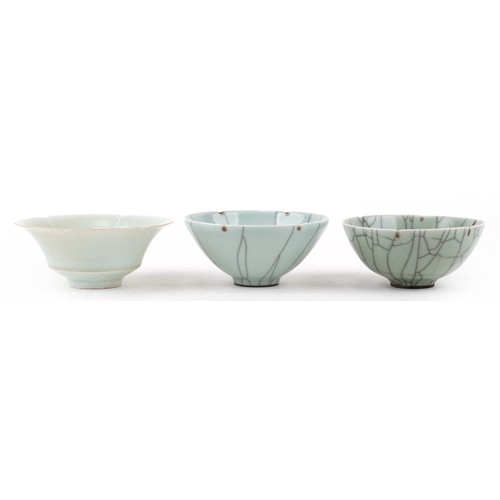 469 - Two similar Chinese green celadon crackle glazed circular bowls, 20th century, signed to bases, 14cm... 