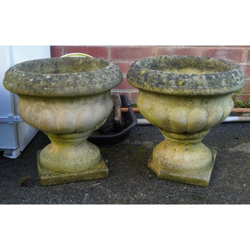 2181 - A pair of 20th century cast composition garden planters of half reeded form on plinth bases, 37cm hi... 