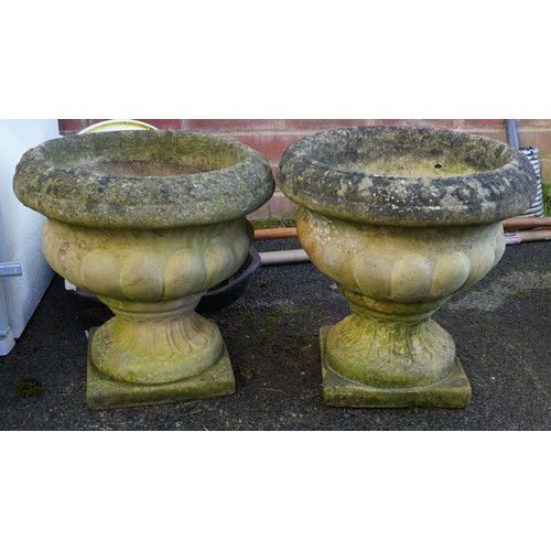 2181 - A pair of 20th century cast composition garden planters of half reeded form on plinth bases, 37cm hi... 