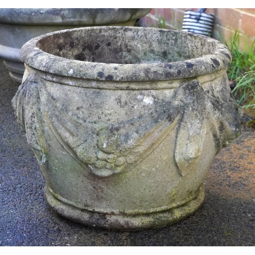 2184 - A 20th century cast composition garden planter with floral swag decoration, 31cm high.