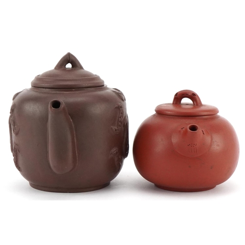 143 - A Chinese Yixing stoneware teapot, 20th century, bearing four character mark to base, 10cm high, tog... 