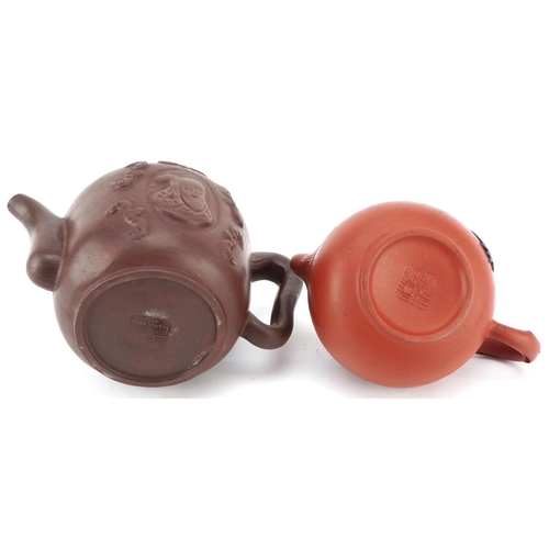 143 - A Chinese Yixing stoneware teapot, 20th century, bearing four character mark to base, 10cm high, tog... 