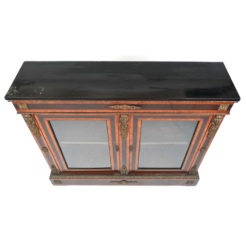  A mid Victorian ebonised and satinwood crossbanded two door pier cabinet with gilt metal mounts, the... 