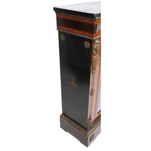  A mid Victorian ebonised and satinwood crossbanded two door pier cabinet with gilt metal mounts, the... 