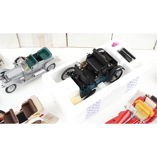 1054 - A collection of predominantly Franklin Mint diecast Precision model vehicles including a 452 Cadilla... 