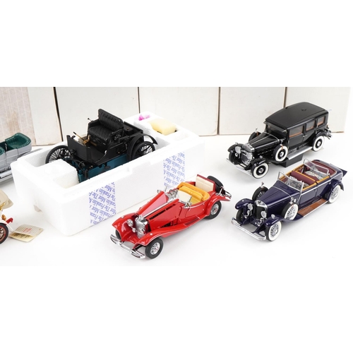 1054 - A collection of predominantly Franklin Mint diecast Precision model vehicles including a 452 Cadilla... 