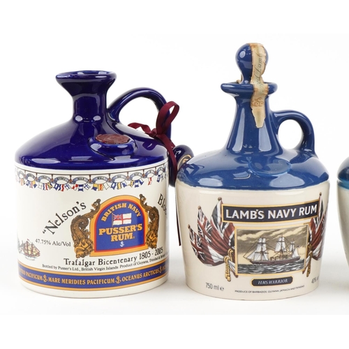 510 - Four bottles of rum including a Nelson's Blood British Navy Pusser's rum and a Lamb's Navy rum.