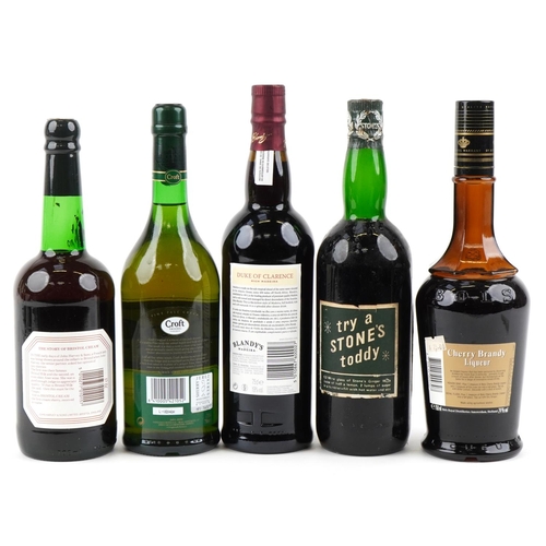 516 - Five bottles of alcohol including a Harvey's Bristol Cream sherry, a Stone's Original Green Ginger w... 