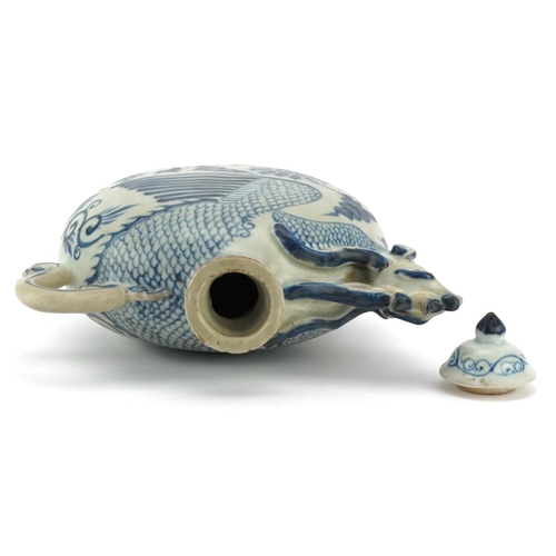 234 - A Chinese porcelain blue and white vessel with cover in the form of a phoenix, 19cm high.