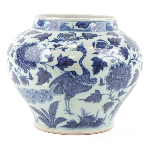 223 - A large Chinese blue and white porcelain vase hand painted with a bird of paradise and foliage, 20th... 