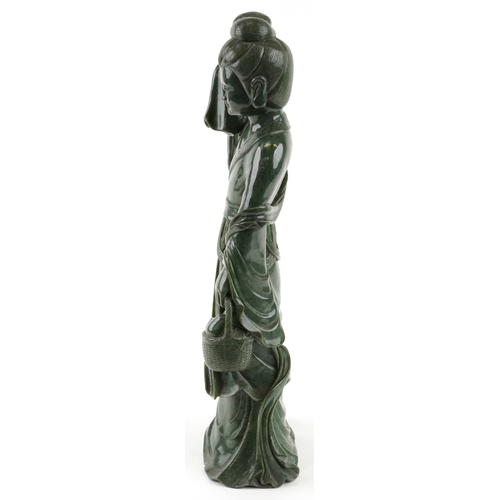 221 - A large Chinese spinach green jade figure of an immortal, 20th century, H-62cm.
