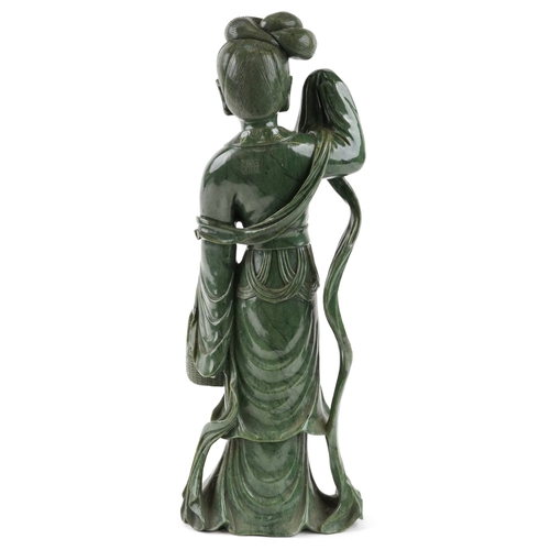221 - A large Chinese spinach green jade figure of an immortal, 20th century, H-62cm.