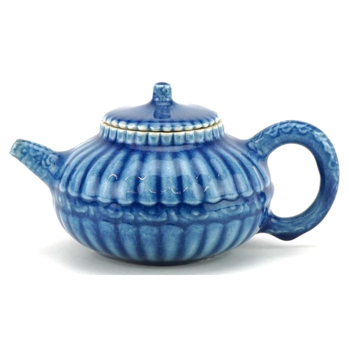 139 - A Chinese porcelain blue glazed teapot, character marks to the base, 18cm in length.
