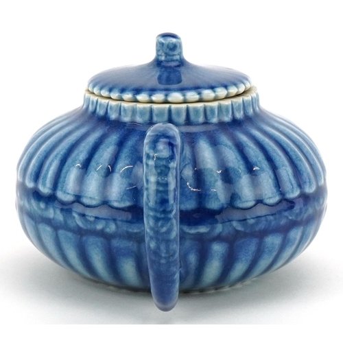 139 - A Chinese porcelain blue glazed teapot, character marks to the base, 18cm in length.