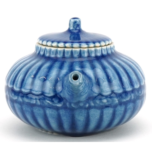 139 - A Chinese porcelain blue glazed teapot, character marks to the base, 18cm in length.