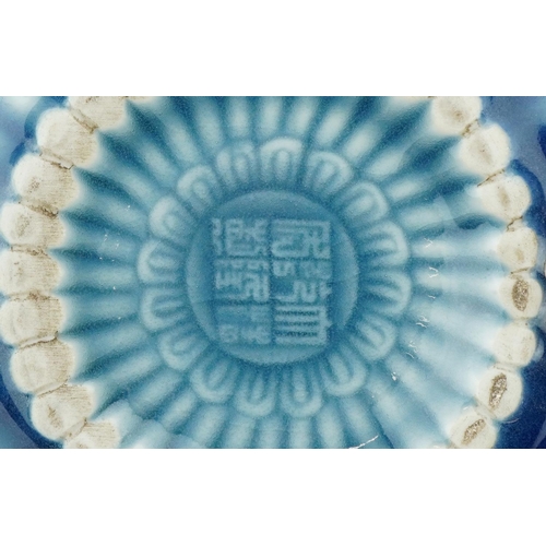 139 - A Chinese porcelain blue glazed teapot, character marks to the base, 18cm in length.