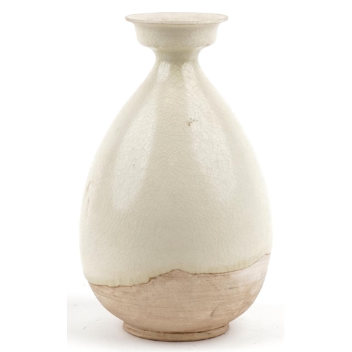 225 - A Chinese cream glazed pottery vase, 26cm high.