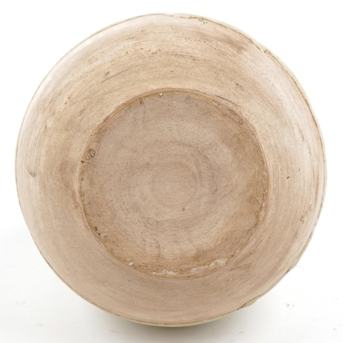 225 - A Chinese cream glazed pottery vase, 26cm high.